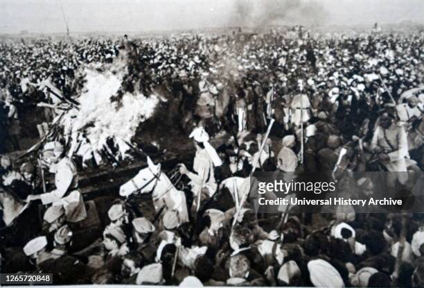 Photograph taking during the cremation of Mahatma Gandhi. Mohandas Karamchand Gandhi an Indian lawyer, anti-colonial nationalist, and political...
