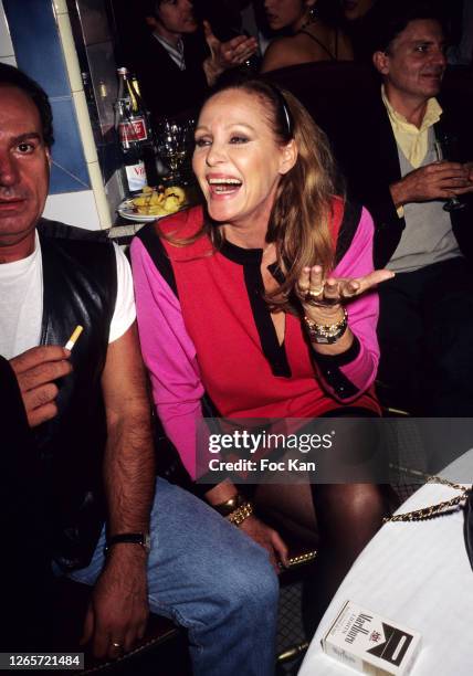 Ursula Andress attends a Venus de La Mode Fashion Party at Les Bains Douches during Paris Fashion Week in the 1990s in Paris, France.