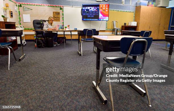 Third grade teacher Lindsey Farney sits in an empty classroom as she talks with her students on the second day of class at Richman Elementary School...