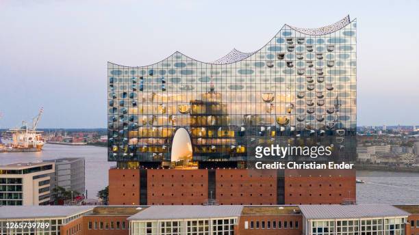 The Elbphilharmonie Concert Hall building stands at sunset during the coronavirus pandemic on August 12, 2020 in Hamburg, Germany.