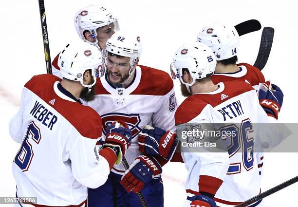 Shea Weber of the Montreal Canadiens is congratulated by teammates Jonathan Drouin, Jeff Petry,Nick Suzuki and Brendan Gallagher of the Montreal...