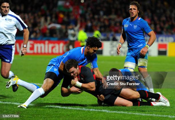Wing George North of Wales crashes over to score his team's eighth try during the IRB 2011 Rugby World Cup Pool D match between Wales and Namibia at...