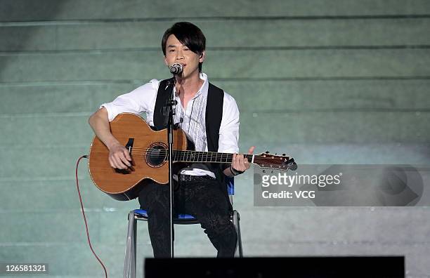 Chinese singer David Tao performs on stage during the first Korea-China-Japan Joint Concert at the Bird's Nest on September 25, 2011 in Beijing,...