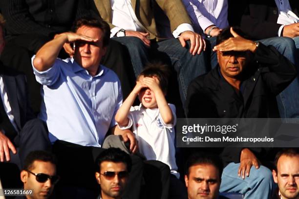 British Prime Minister David Cameron and his son Arthur sit with Indian Steel Magnate Lakshmi Mittal during the Barclays Premier League match between...