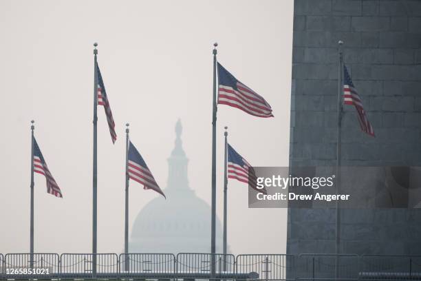 Wildfire smoke casts a haze over the National Mall on June 29, 2023 in Washington, DC. The Washington DC region is under a "Code Red" air quality...