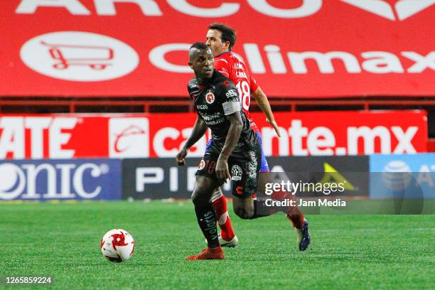 Miller Bolanos of Tijuana fights for the ball with Camilo Mayada of San Luis during the 4th round match between Tjuana and Atletico San Luis as part...