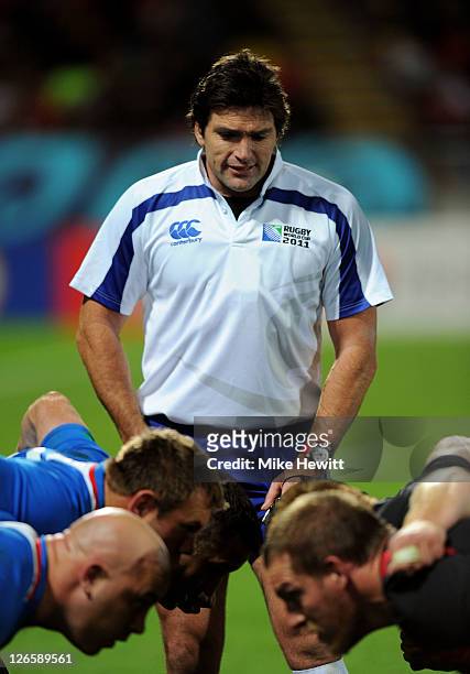 Referee Steve Walsh of Australia officiates at a scrummage during the IRB 2011 Rugby World Cup Pool D match between Wales and Namibia at Stadium...