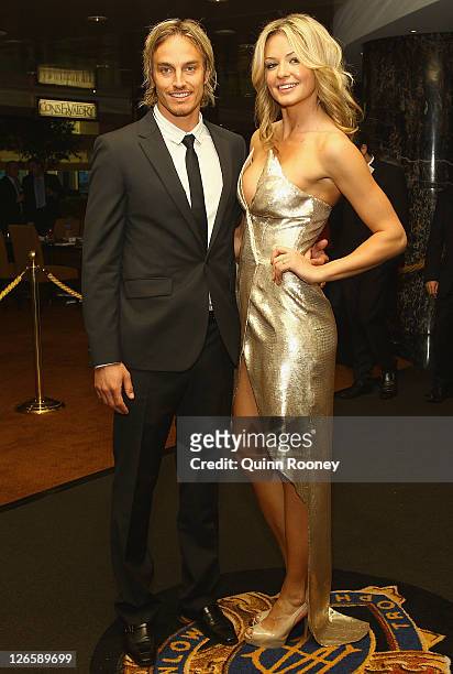 Mark Nicoski of the Eagles and Renae Wauhop pose during the 2011 Brownlow Medal at Crown Palladium on September 26, 2011 in Melbourne, Australia.