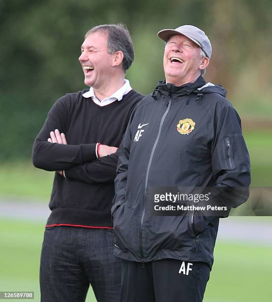 Bryan Robson and Sir Alex Ferguson of Manchester United in action during a first team training session ahead of their UEFA Champions League Group C...