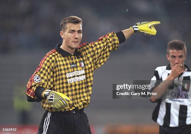 Feyenoord goalkeeper Jurek Dudek signals to his team mates during a UEFA Champions League match against Juventus at the Delle Alpi Stadium in Turin,...