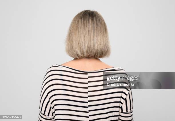 rear view of mature woman - mid length hair stock pictures, royalty-free photos & images