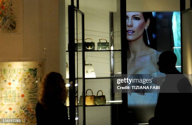 People attend on September 26, 2011 the opening of the Gucci Museum at Palazzo della Mercanzia in Piazza della Signoria in Florence. AFP PHOTO /...