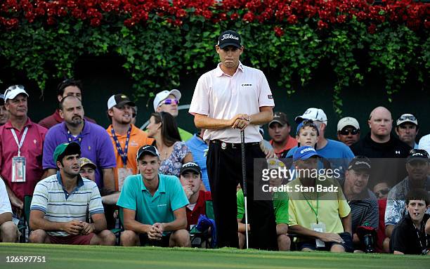 Bill Haas watches play on the 18th hole during the final round of the TOUR Championship by Coca-Cola, the final event of the PGA TOUR Playoffs for...