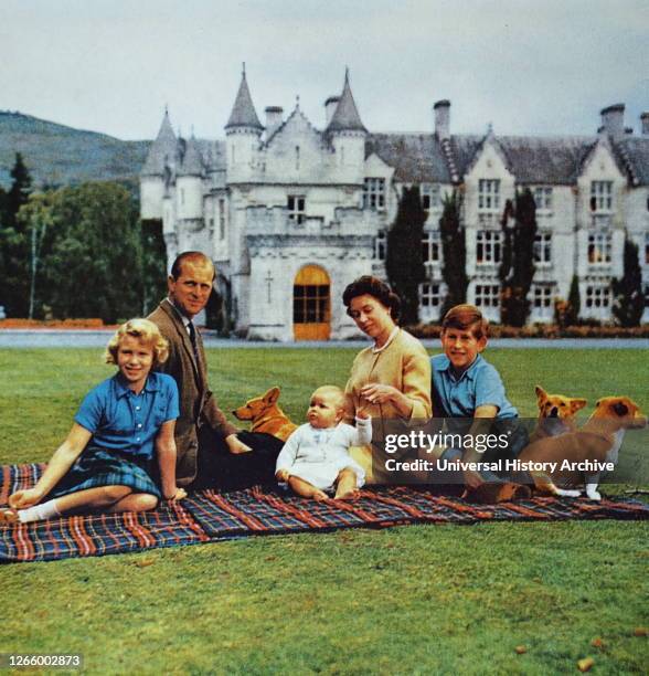 Photograph of Queen Elizabeth II with the Duke of Edinburgh and their children at Balmoral Castle.