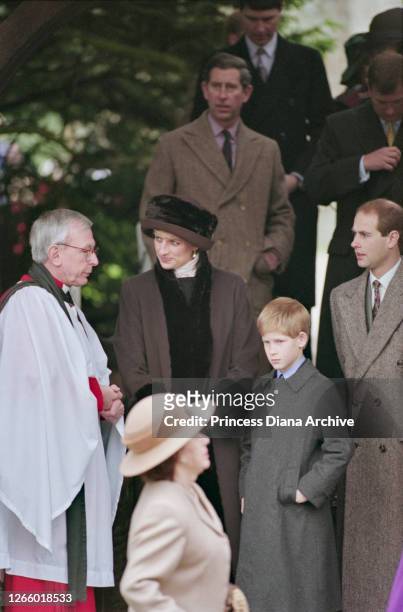 British Royals Diana, Princess of Wales , wearing a brown coat with black trim and a matching winter hat, Prince Charles, Prince Harry, and Prince...