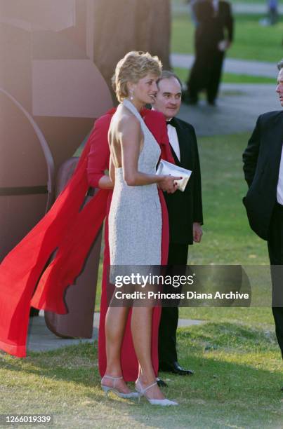 British Royal Diana, Princess of Wales , wearing a pale blue halter-neck dress by fashion designer Catherine Walker, with co-director of the...