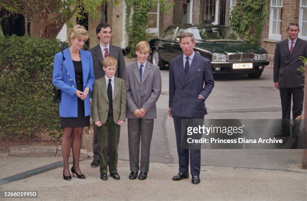 British Royal Diana, Princess of Wales , wearing a blue jacket over a black dress, with Eton housemaster Dr Andrew Gailey, Prince Harry, Prince...