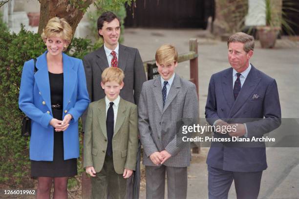 British Royal Diana, Princess of Wales , wearing a blue jacket over a black dress, with Eton housemaster Dr Andrew Gailey, Prince Harry, Prince...