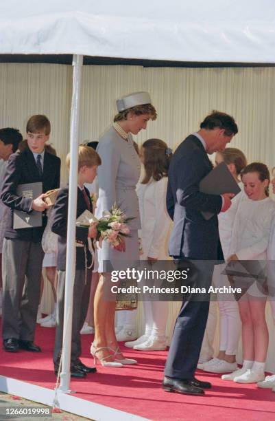 British Royal Prince William, with his brother Prince Harry, mother Diana, Princess of Wales , wearing a light blue suit and matching pillbox hat,...