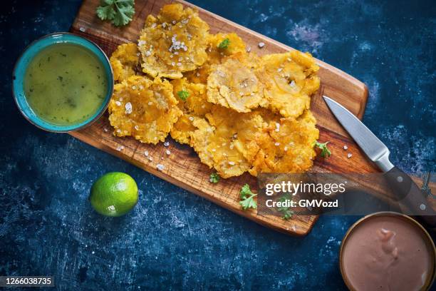 tostones puerto rican fried plantains - puerto rican culture stock pictures, royalty-free photos & images