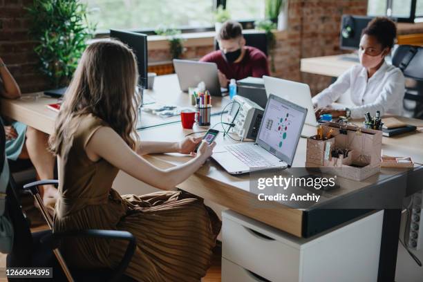 woman using contact tracing application to detecting infected people. - contact tracing stock pictures, royalty-free photos & images