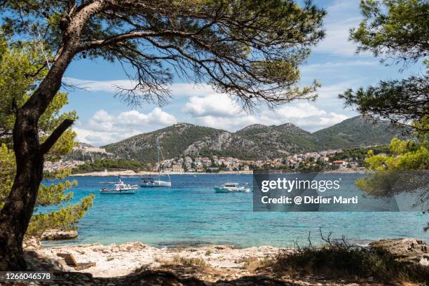 a view of the famous hvar island from the jerolim island in croatia - hvar stockfoto's en -beelden