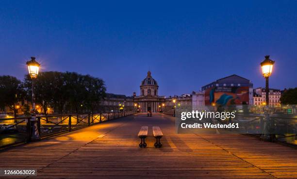 bridge leading to dome of pont des arts against clear blue sky at sunset, paris, france - pont des arts photos et images de collection
