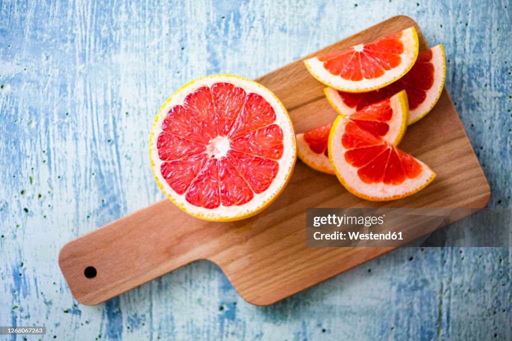 Fresh grapefruit on chopping board