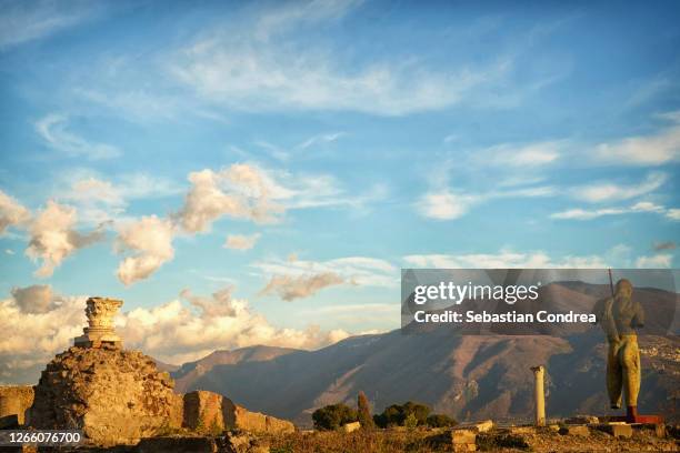 pompeii, italy. temple of jupiter or capitolium or temple of capitoline triad on background of mount vesuvius. - ancient ruins stock pictures, royalty-free photos & images