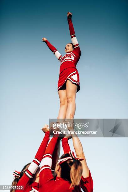 cheerleader team creating a perform - dance team stock pictures, royalty-free photos & images