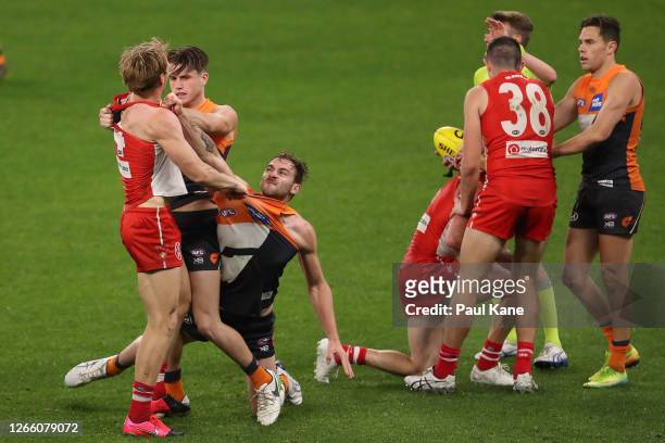 Callum Mills of the Swans remonstrates with Xavier O'Halloran and Jeremy Finlayson of the Giants after heavy tackle on Harry Cunningham during the...