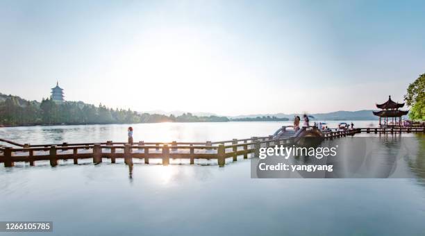 hangzhou west lake landscape at sunset - hangzhou stock pictures, royalty-free photos & images