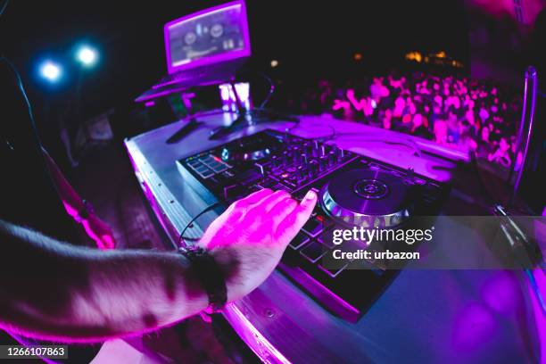 dj playing and mixing music at party - house music stock pictures, royalty-free photos & images