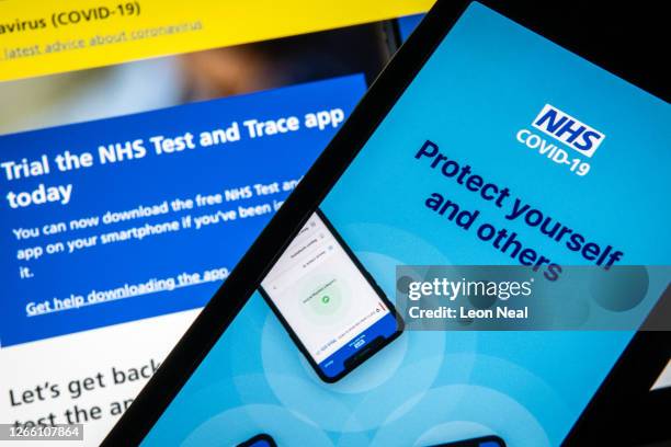 In this photo illustration the official NHS Covid-19 "Test and Trace" contact tracing app is seen on a screen on August 13, 2020 in London, England....