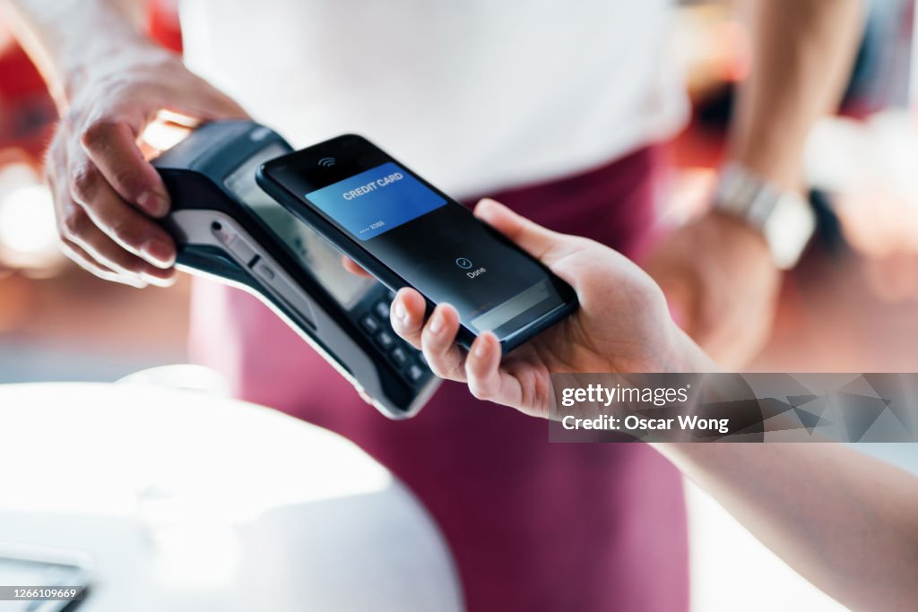 Paying With Mobile Phone At Restaurant