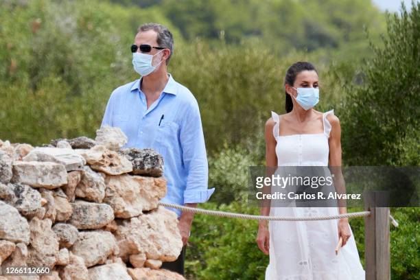 King Felipe VI of Spain and Queen Letizia of Spain are seen arrive at the Naveta des Tudons, oldest building in Europe, asset of cultural interest...