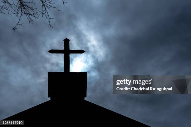 christianity religion, cross at the church of the christian faith on halloween night. - catholicism bildbanksfoton och bilder