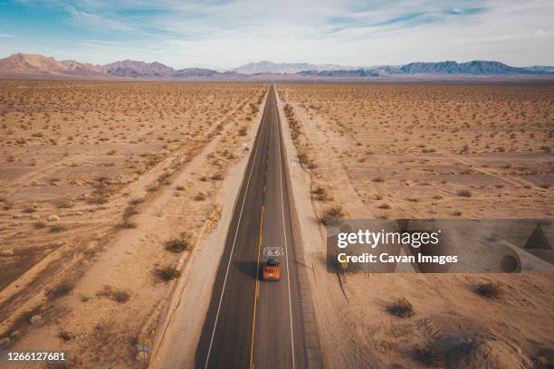 a car on highway 66 from above, california - amboy california stock-fotos und bilder