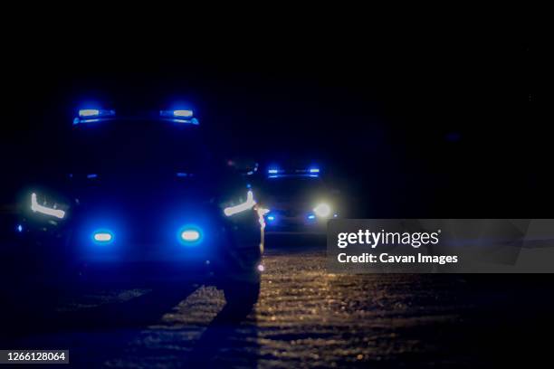 police checks at night during confinement - police rescue stock pictures, royalty-free photos & images