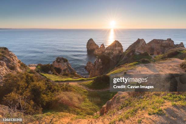 ponta da piedade in lagos at sunrise - ponta da piedade - fotografias e filmes do acervo