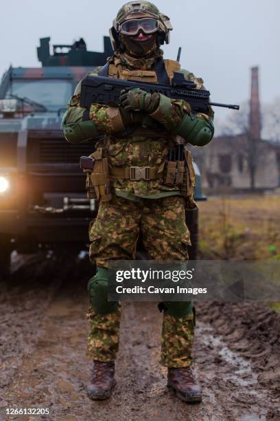 ukraine modern soldier moves undercover armored car - army soldier bildbanksfoton och bilder