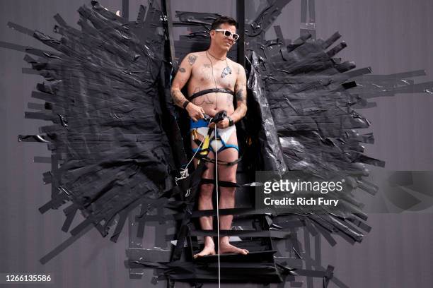 Steve-O is seen attached to a billboard in promotion of his new special "Gnarly" on August 13, 2020 in Hollywood, California.