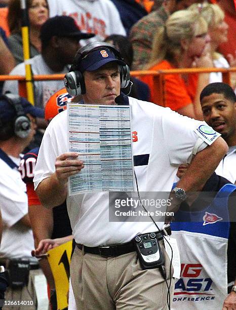 Doug Marrone, head coach of the Syracuse Orange looks on from the side line during the team's overtime win against the Toledo Rockets on September...