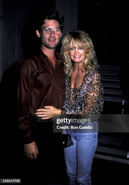 Actor Kurt Russell and actress Goldie Hawn on July 23, 1983 leave the Carlyle Hotel for a night out in New York City.