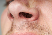 male nose with a long hair. body care concept. macro