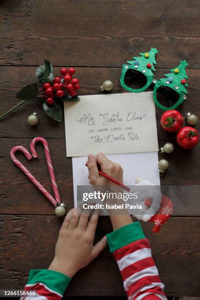 little boy writing letter to santa claus. christmas time - christmas list stock pictures, royalty-free photos & images