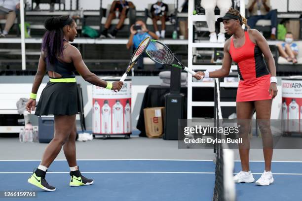 Serena Williams and Venus Williams touch rackets after Serena Williams defeated Venus Williams 3-6, 6-3, 6-4 during Top Seed Open - Day 4 at the Top...