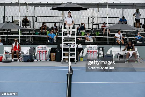 Venus Williams and Serena Williams rest between games during their match during Top Seed Open - Day 4 at the Top Seed Tennis Club on August 13, 2020...