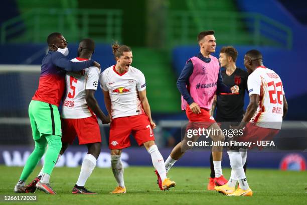 Marcel Sabitzer of RB Leipzig and Nordi Mukiele of RB Leipzig celebrate following their team's victory in the UEFA Champions League Quarter Final...