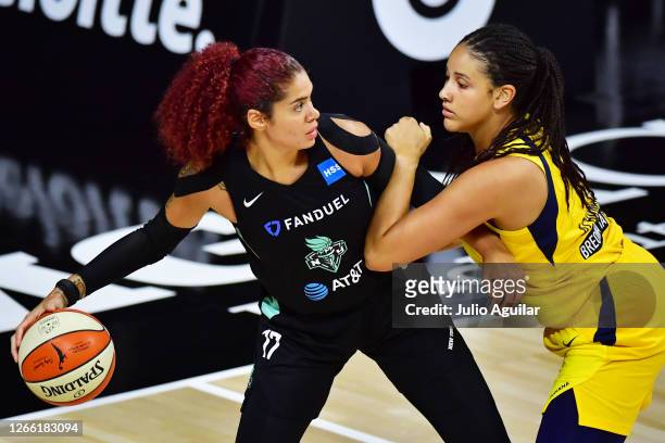 Amanda Zahui B. #17 of the New York Liberty keeps the ball from Natalie Achonwa of the Indiana Fever during the first half at Feld Entertainment...